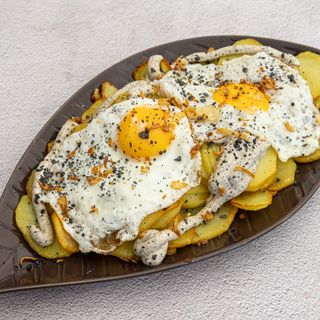 huevos rotos trufados