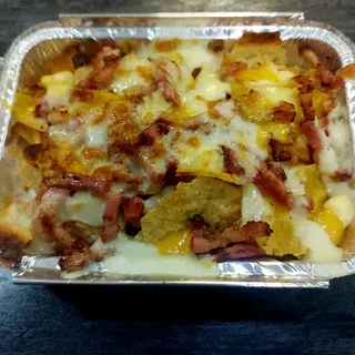 Nachos con bacon,mozzrela,cheso cheddar 