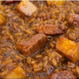 Arroz meloso de secreto y manzana