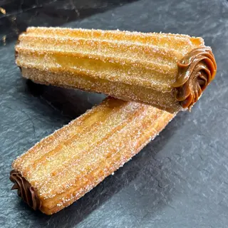 Xuixo relleno con dulce de leche. (Ud)