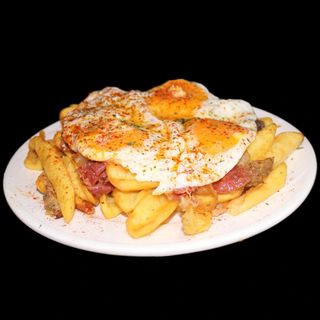 Huevos rotos trufados.