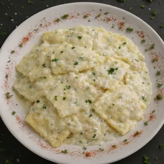Ravioles con salsa 4 quesos