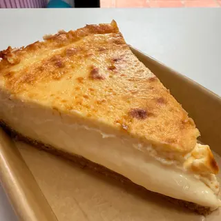 Cheesecake mango porción