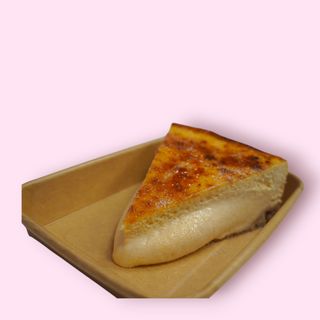 Cheesecake turrón yema tostada (porción)