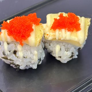 l99A. Bolas de arroz con queso flameado