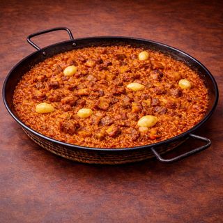 Arroz de secreto ibérico, torreznos y ajos confitados