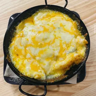 Patatas gratinadas al roquefort (ración)
