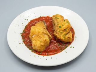 Merluza con fritá de tomate