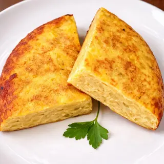 1/4 Tortilla de patatas y cebolla