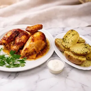Lote de medio pollo a l’ast (Medio pollo asado) con patatas al caliu