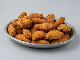 Alitas adobadas y fritas