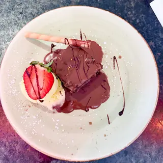 Indulgent warm home made chocolate brownie