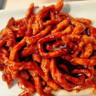 Lomo de cerdo salteado con salsa original de Pekín