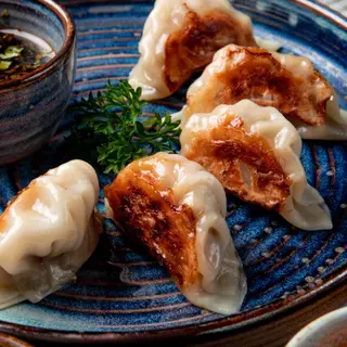 210 Gyoza polla la plancha