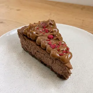Tarta De Queso Con Chocolate Y Dulce De Leche (Porción)