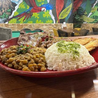 Chuleta (Cerdo) + Arroz+ Platano + menestra