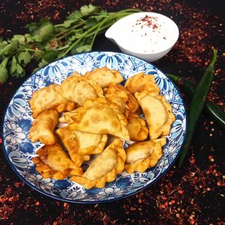 Fried dumplings with potatoes and mushrooms 