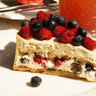 Berry cake slice with pistachio cream