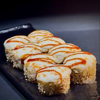 Baked roll with cheese sauce