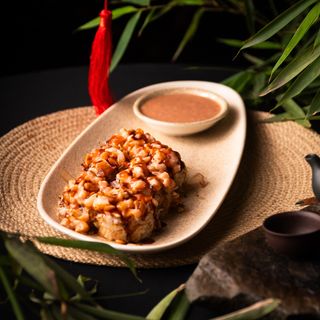 Roll with salmon and wild berry sauce