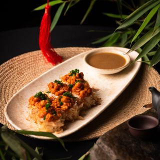 Roll with salmon and almond sauce