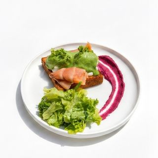 Egg's Benedict with verde sause and salmon
