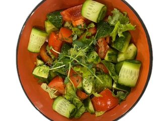 Tomato and cucumber salad with olive oil