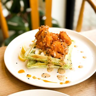 Spinach waffles with shrimps and sesame sauce