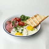 Fried eggs with mortadella