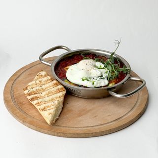 Shakshuka with sulguni and poached egg