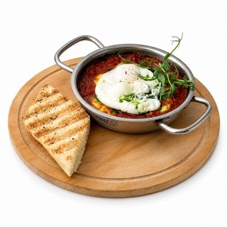 Shakshuka with suluguni and poached egg