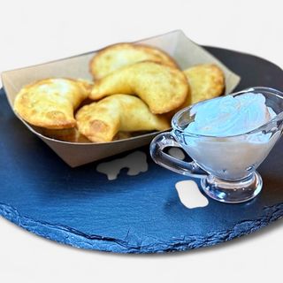 Dumplings with salty cottage cheese and greens