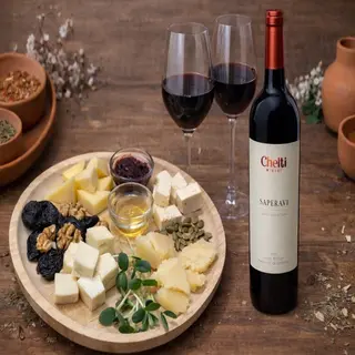 Cheese Board with Honey and Jam and Chelti Saperavi Wine Bottle