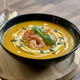 Pumpkin cream soup with shrimps