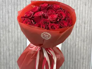 17 red roses styled in a modern design