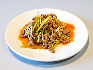 Vitello con cipollotti cinesi