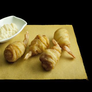 Gamberi in nido di patate