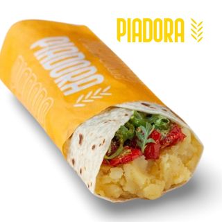 Patate bollite, pomodorini secchi, rucola e pesto di pistacchi