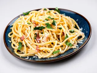 Casarecce con speck croccante e delicata allo zafferano