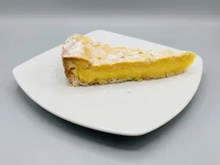 Fetta torta crema & pinoli