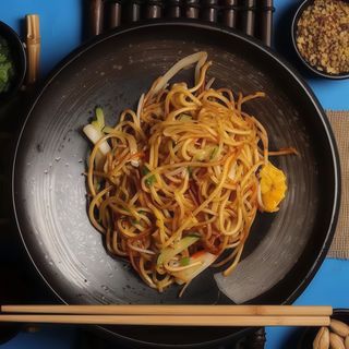 Spaghetti di riso con pesce misto