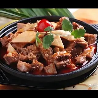 113-Manzo con carni miste in coccio alla candela