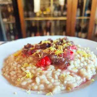Risotto con Cipolla Rossa caramellata, Lamponi essiccati e Limone