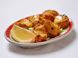 Tikka mughlai di pollo