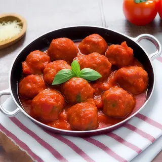 Polpette di pollo in sugo con tortino di riso