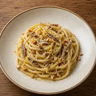 Spaghettone Burro e Alici con Mandorla Ripassata e Scorza di Limone