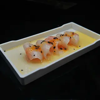 104. Carpaccio branzino - 10 pezzi