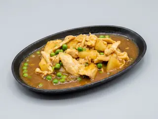 120 Pollo con piselli in salsa"sa za"alla piastra