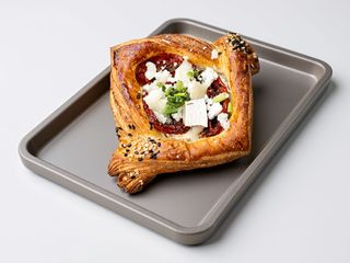 Goat cheese, double baked tomatoes and chives oil Danish