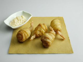 Gamberi in nido di patate
